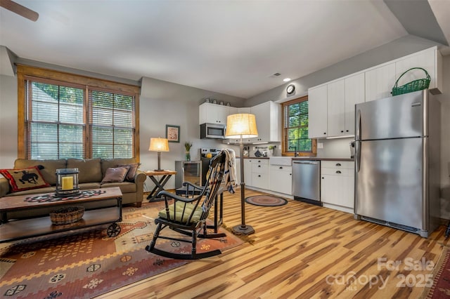 living room with light hardwood / wood-style flooring