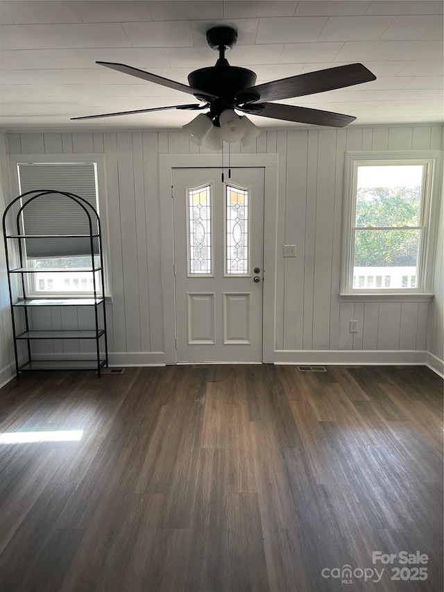 foyer with ceiling fan and dark hardwood / wood-style flooring