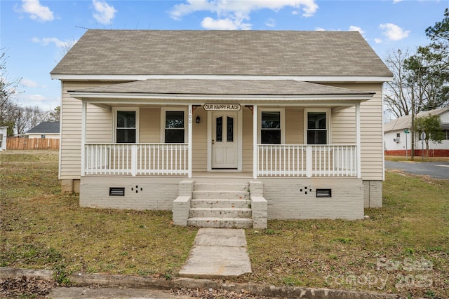 100 Lear St, Rockingham, NC 28379 - bungalow-style home with a shingled roof, a porch, and crawl space