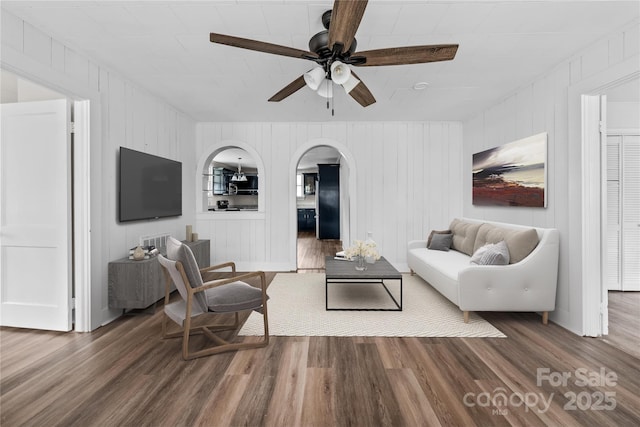 100 Lear St, Rockingham, NC 28379 - living area with ceiling fan, arched walkways, and wood finished floors