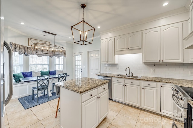 kitchen with white cabinetry, sink, pendant lighting, and appliances with stainless steel finishes