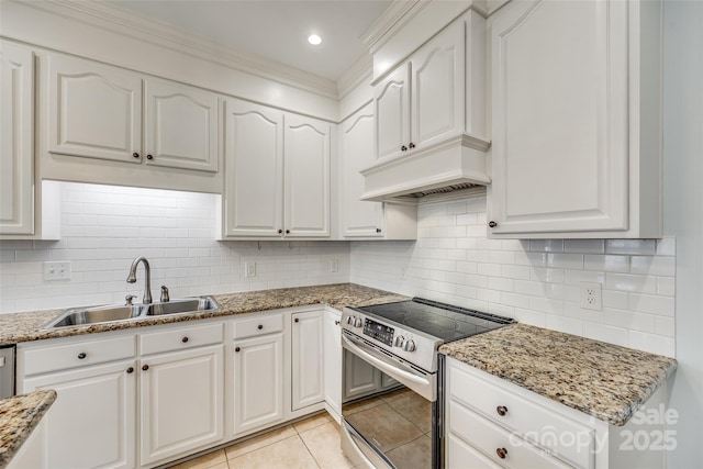 kitchen featuring sink, stainless steel range with electric stovetop, and white cabinets