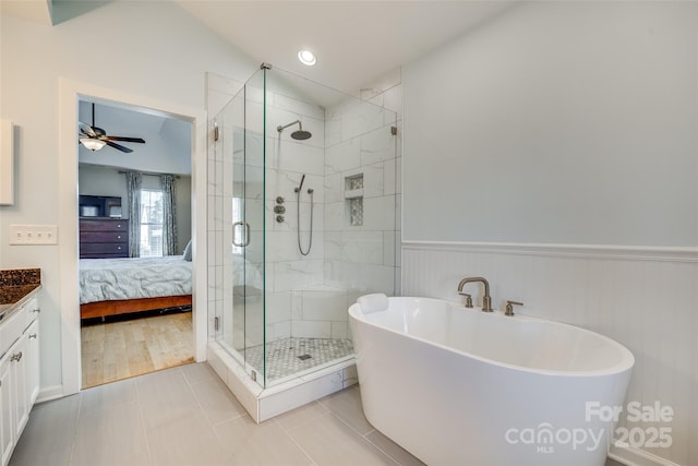 bathroom with separate shower and tub, ceiling fan, tile patterned flooring, and vanity