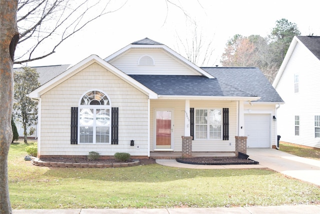 view of front of property with a shingled roof, a front yard, concrete driveway, and an attached garage