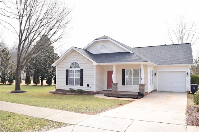 view of front of home with an attached garage, driveway, a shingled roof, and a front yard