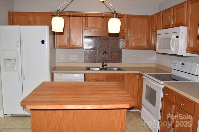 kitchen featuring light tile patterned floors, white appliances, butcher block countertops, a sink, and a center island