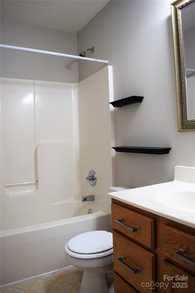 bathroom with toilet, a textured ceiling, shower / tub combination, and vanity