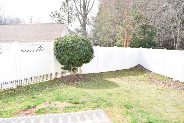 view of yard with a fenced backyard