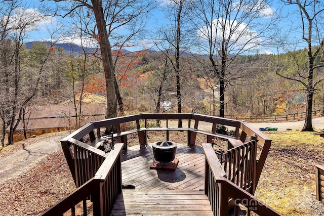 deck featuring a forest view