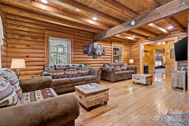 living area with rustic walls, light wood-style flooring, wood ceiling, and beam ceiling