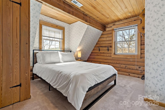 bedroom featuring multiple windows, carpet flooring, and wallpapered walls