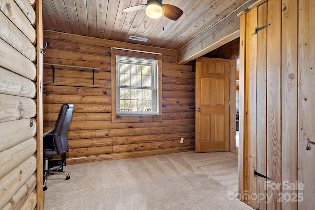 unfurnished office with visible vents, wood ceiling, ceiling fan, carpet, and log walls