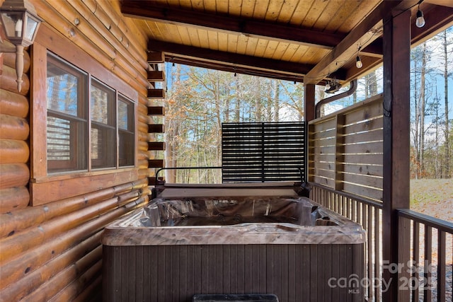 bathroom featuring wood ceiling, log walls, and beam ceiling