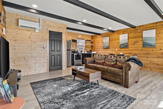 living area featuring beam ceiling, a wall mounted air conditioner, wood walls, and light wood-style flooring