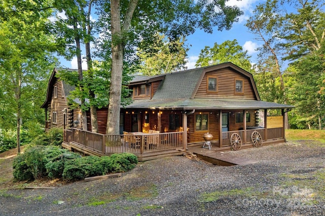 40/44 Chambers Dr, Weaverville, NC 28787 - log cabin featuring a porch, a gambrel roof, roof with shingles, and log exterior