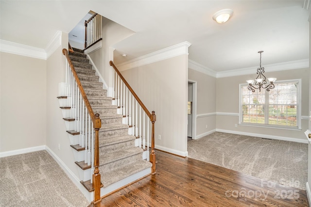 staircase featuring crown molding and baseboards