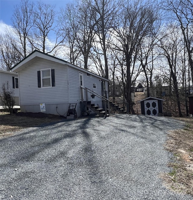 view of side of property with a storage shed