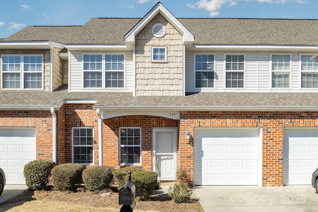 townhome / multi-family property featuring a garage