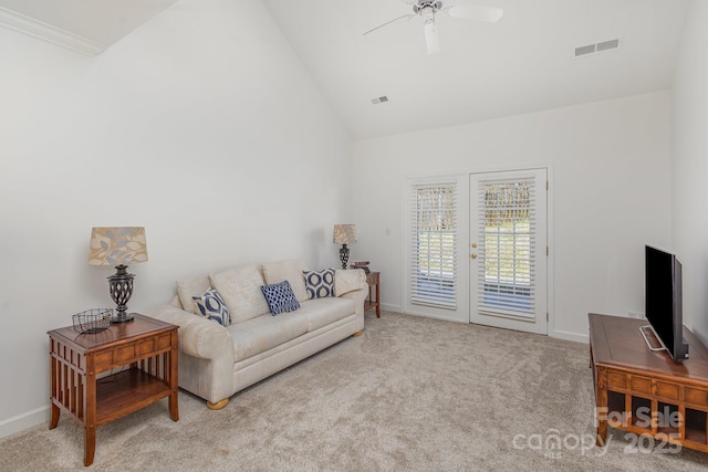 living room featuring french doors, high vaulted ceiling, light colored carpet, and ceiling fan