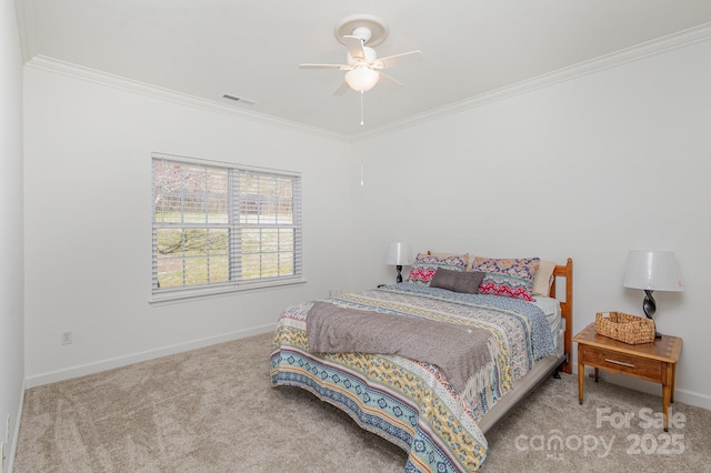 bedroom featuring ceiling fan, crown molding, and carpet flooring