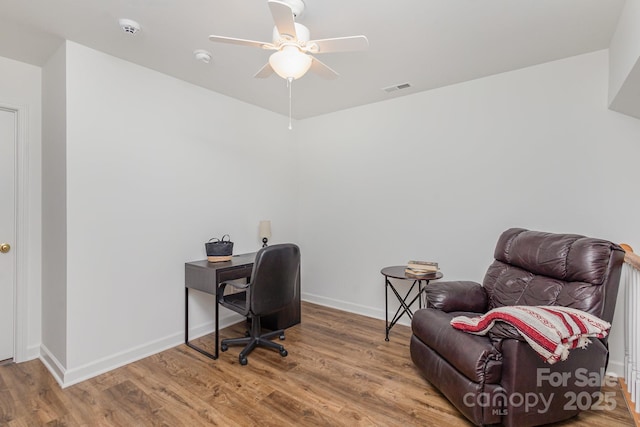 office space featuring hardwood / wood-style flooring and ceiling fan