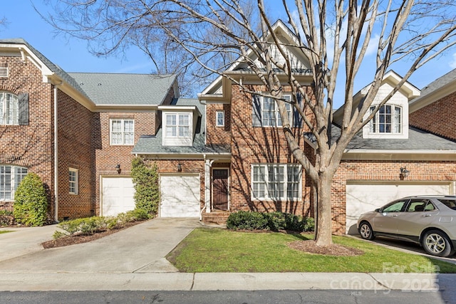 view of front of house with a front yard and a garage