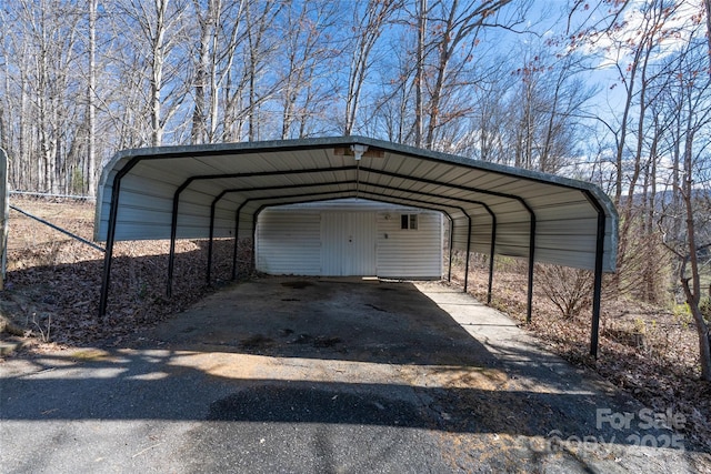 view of parking / parking lot with a detached carport