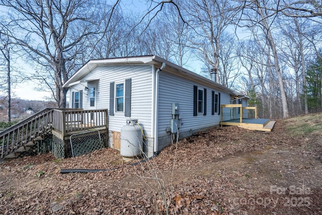 view of home's exterior with a deck