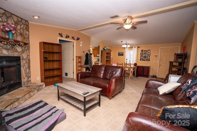 living room featuring a textured ceiling, light colored carpet, a fireplace, visible vents, and vaulted ceiling