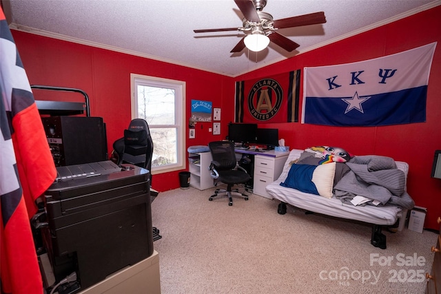 office area featuring a textured ceiling, ceiling fan, carpet flooring, and crown molding