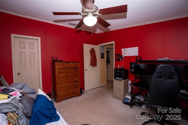 carpeted bedroom featuring visible vents, crown molding, a textured ceiling, and ceiling fan