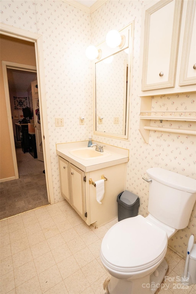 bathroom featuring toilet, wallpapered walls, tile patterned floors, and vanity