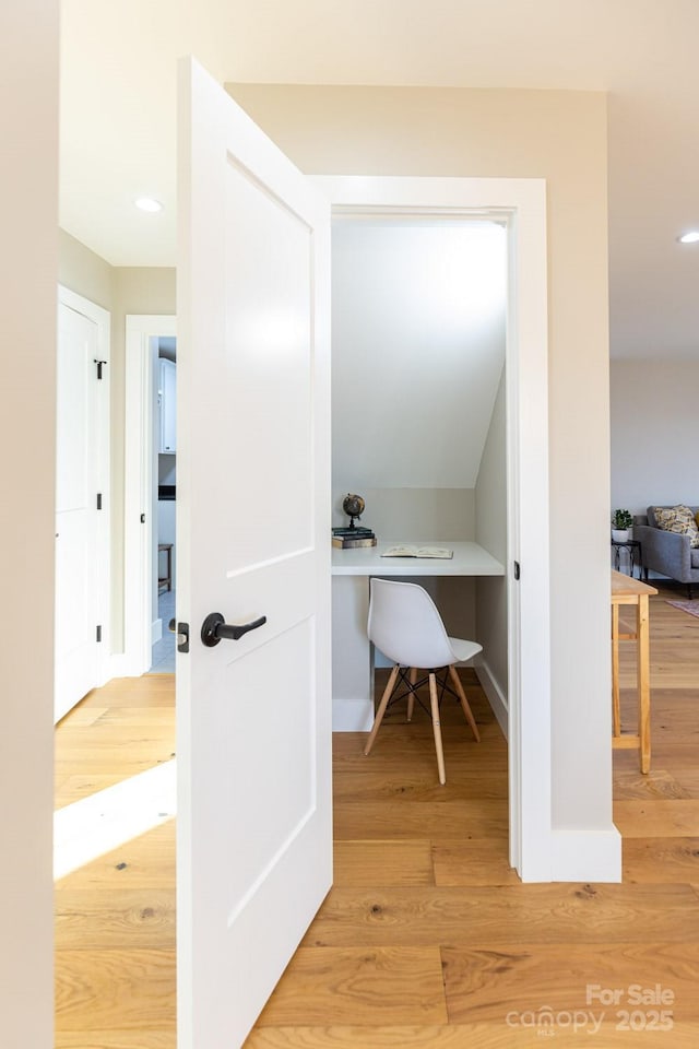 interior space with recessed lighting, wood finished floors, and baseboards