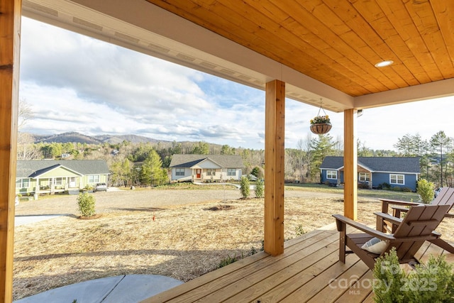 deck featuring a residential view and a mountain view