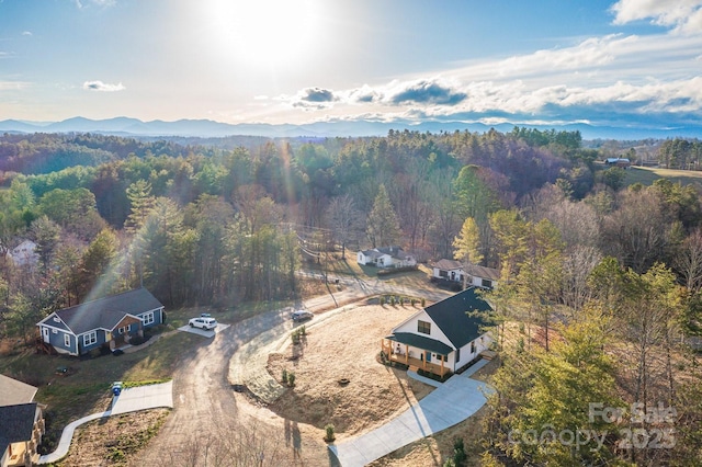 drone / aerial view featuring a view of trees