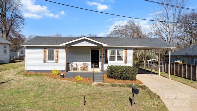 view of front of house with a porch, a carport, and a front yard