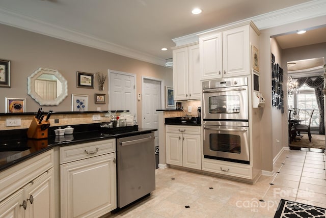 kitchen with stainless steel appliances, tasteful backsplash, light tile patterned flooring, and crown molding