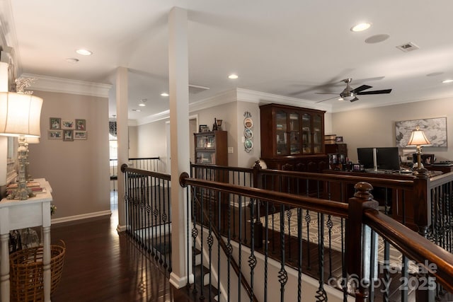 corridor featuring dark wood-type flooring and ornamental molding