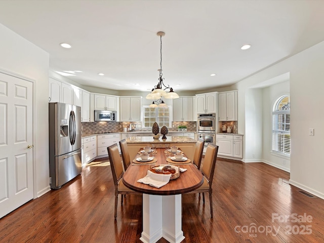 dining room with dark wood-type flooring