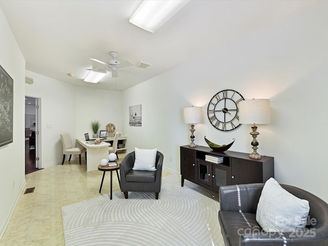 living area with ceiling fan