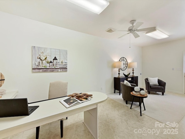 carpeted office featuring ceiling fan