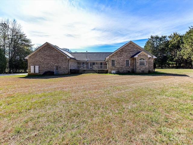 ranch-style house with a front lawn