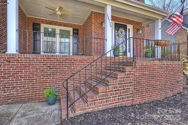 property entrance featuring ceiling fan and a porch