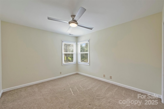 unfurnished room featuring ceiling fan and carpet floors