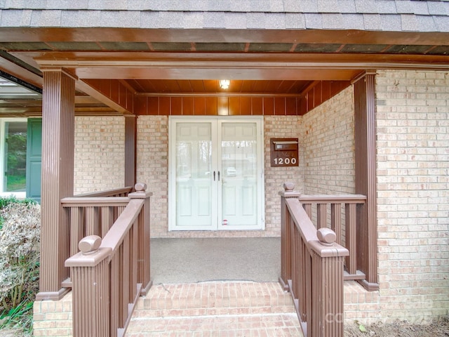 view of exterior entry featuring french doors