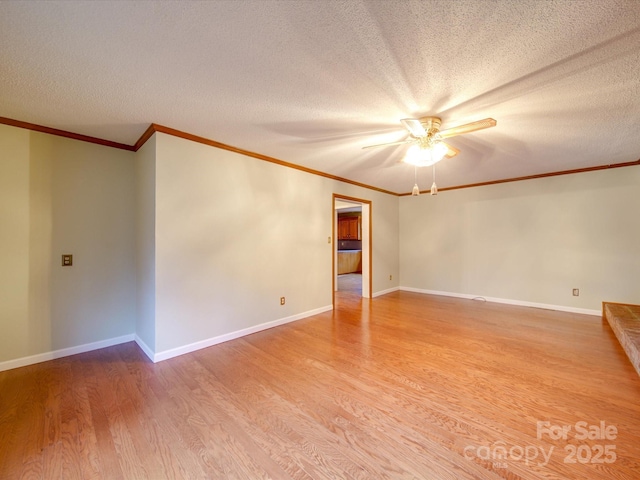 empty room with ornamental molding, wood-type flooring, and a textured ceiling