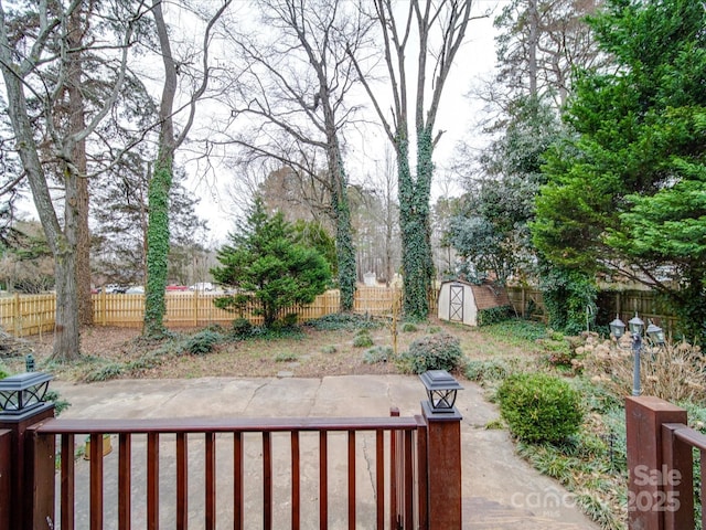 view of patio featuring a storage unit