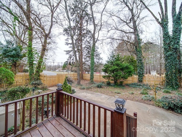 wooden terrace featuring a patio area