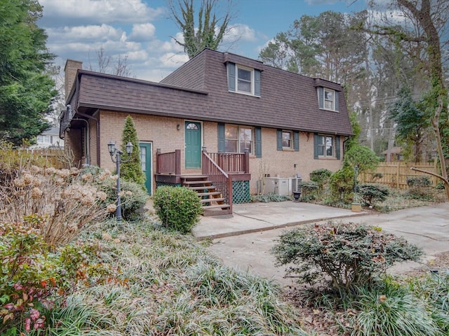 rear view of property with a patio area