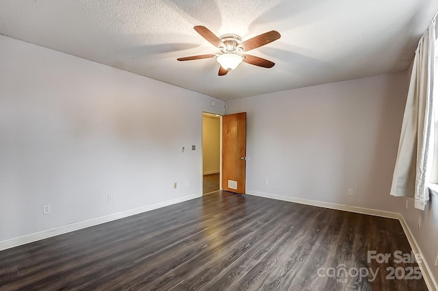 unfurnished room with ceiling fan, a textured ceiling, and dark hardwood / wood-style flooring